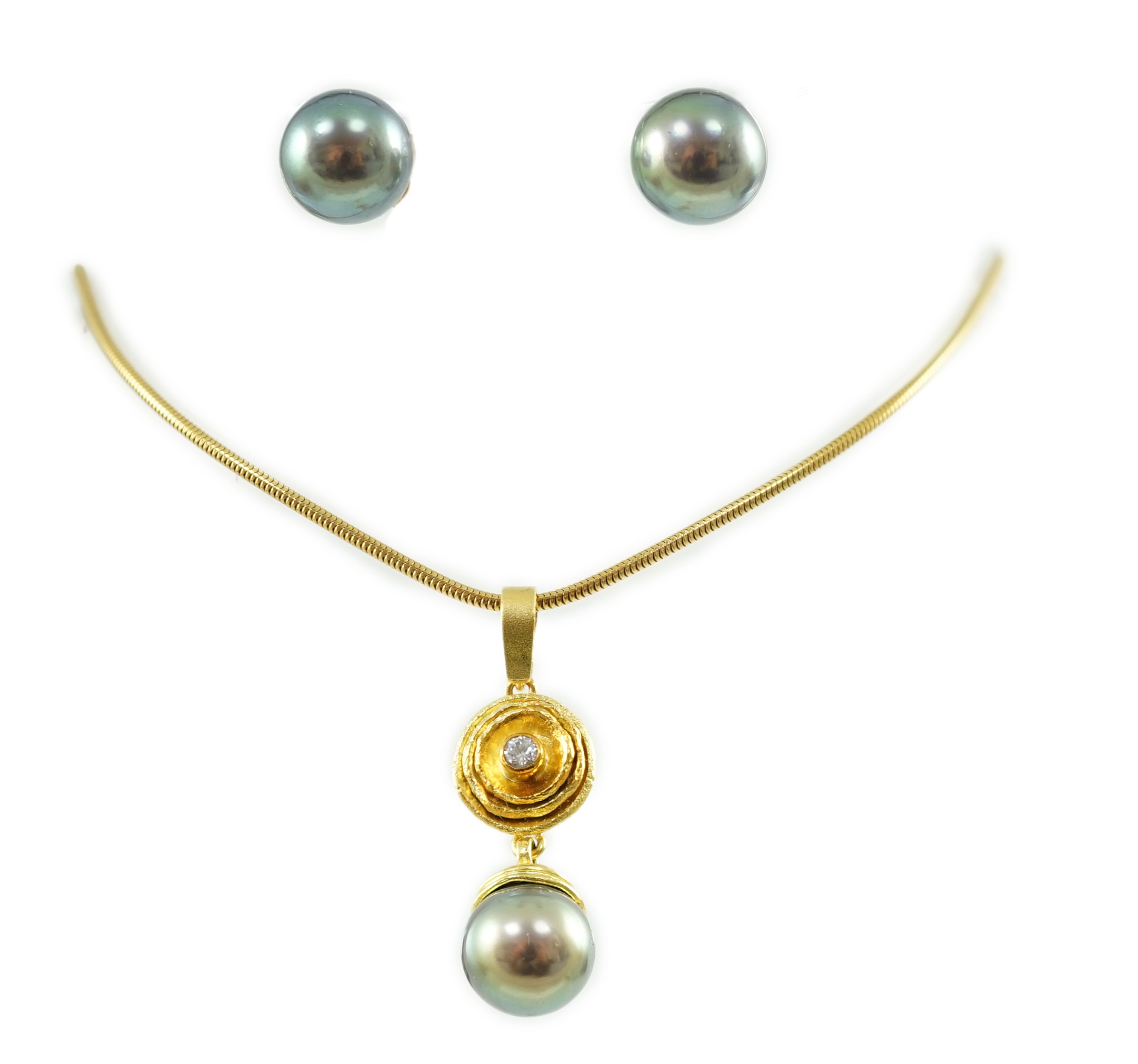 A modern textured gold, diamond and Tahitian pearl set drop pendant, on an 18ct gold snake link chain, in Asprey & Garrard box and a pair of 18ct gold and Tahitian pearl earrings, in Asprey & Garrard box